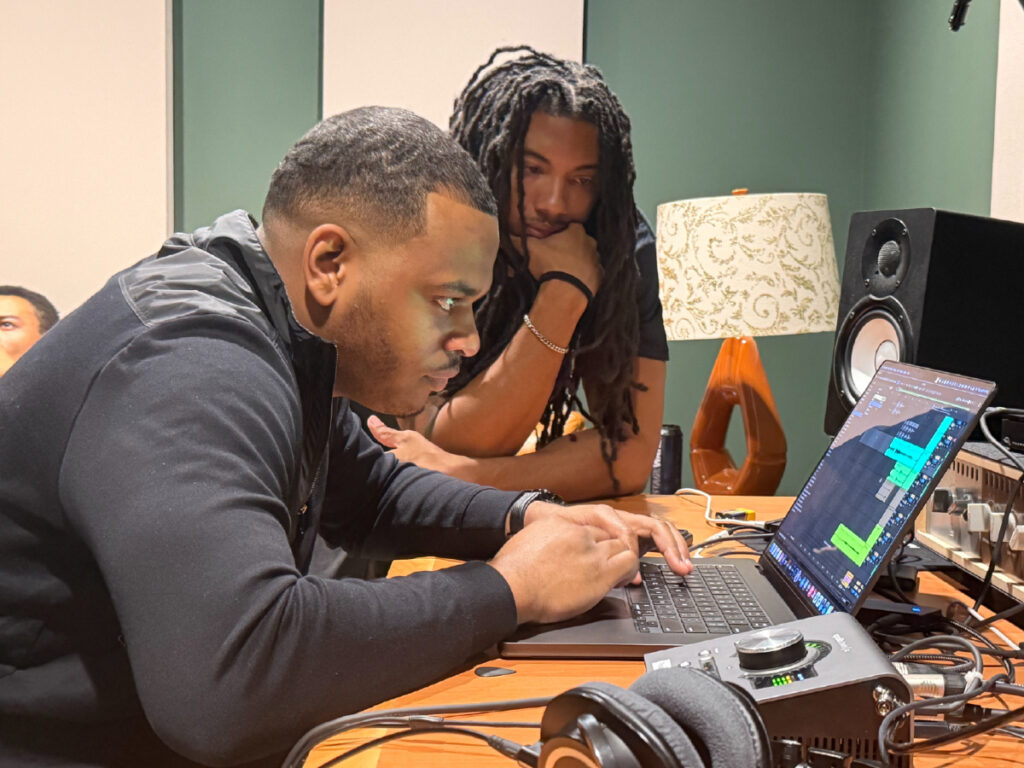 Dom (facing forward) collaborating with fellow producer K.J. Mitchell at the 2026 edition of the Kinfolk Nashville writing camp.